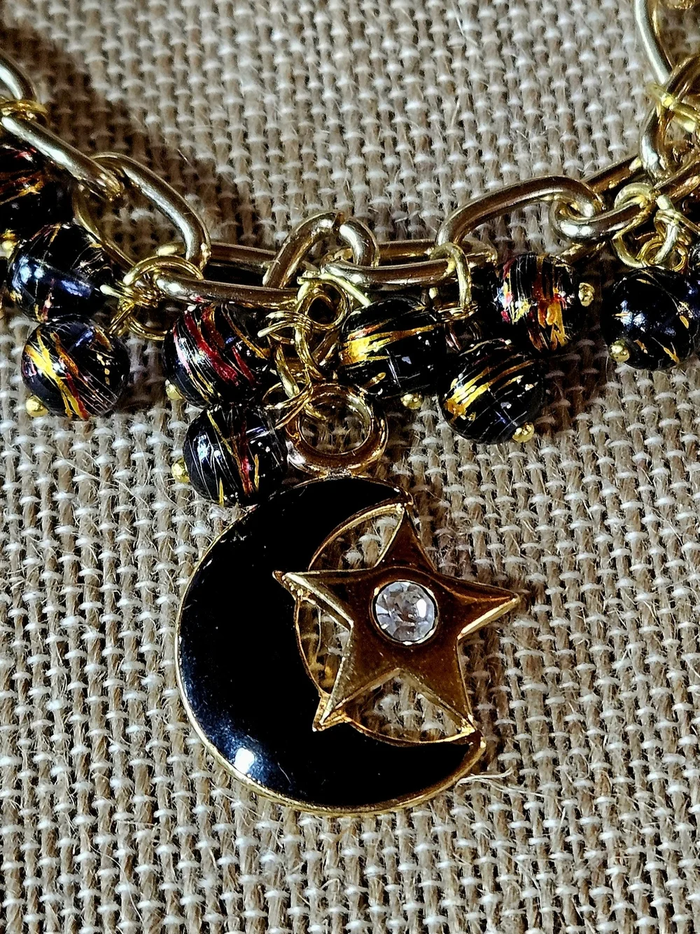 Gold-Tone Moon, Stars And Black Bats Charm Bracelet in Black and Yellow - Picture 4 of 8
